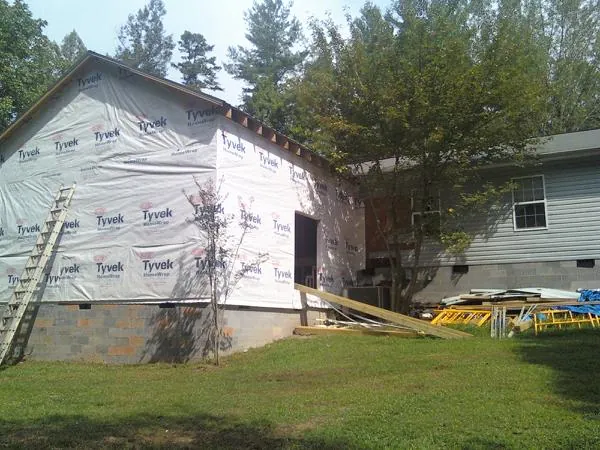 Tyvek wrapped gable on a new room addition beside an existing home in Doylesburg